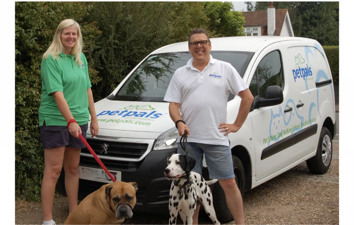a couple with two dogs