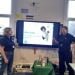 Two women giving a presentation to primary students