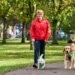 Clare Balding walking with two dogs